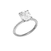 A three-quarter view of the Elongated cushion cut diamond engagement ring in platinum with a pavé diamond band and cathedral setting