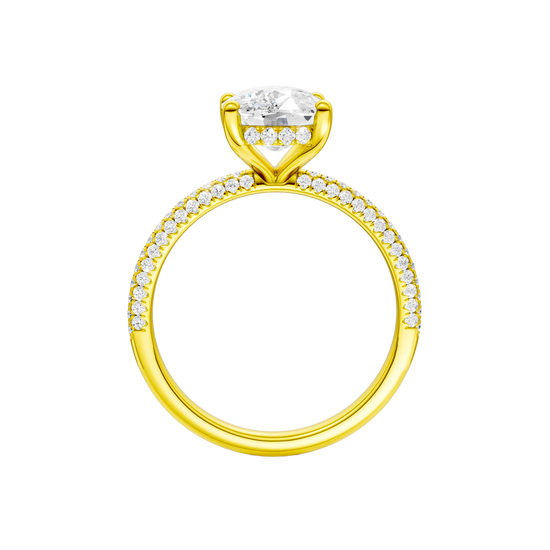 A front view of the Elongated cushion cut diamond engagement ring in 14k yellow gold with a pavé diamond band and cathedral setting