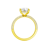 A front view of the Elongated cushion cut diamond engagement ring in 14k yellow gold with a pavé diamond band and cathedral setting
