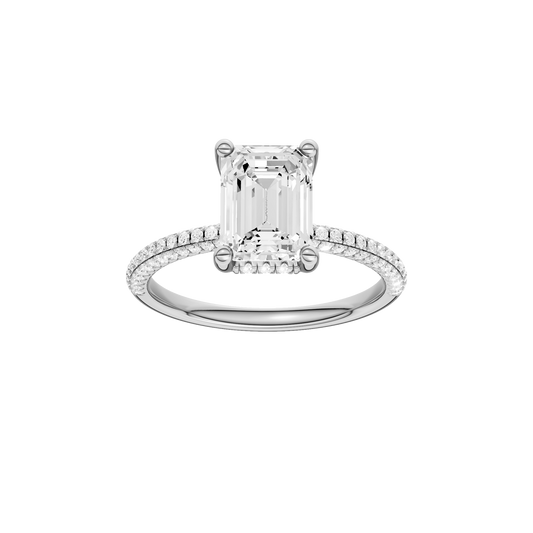 A front view of the Emerald cut diamond engagement ring in 14k white gold with a pavé diamond band and cathedral setting