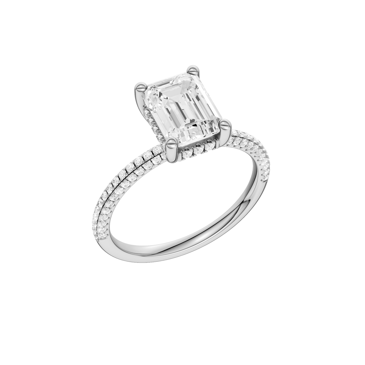 A three-quarter view of the Emerald cut diamond engagement ring in 14k white gold with a pavé diamond band and cathedral setting