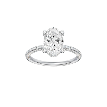 A front view of the Oval cut diamond engagement ring in 14k white gold with a pavé diamond band and cathedral setting