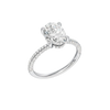 A three-quarter view of the Oval cut diamond engagement ring in 14k white gold with a pavé diamond band and cathedral setting