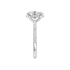 A side view of the Oval cut diamond engagement ring in platinum with a pavé diamond band and cathedral setting