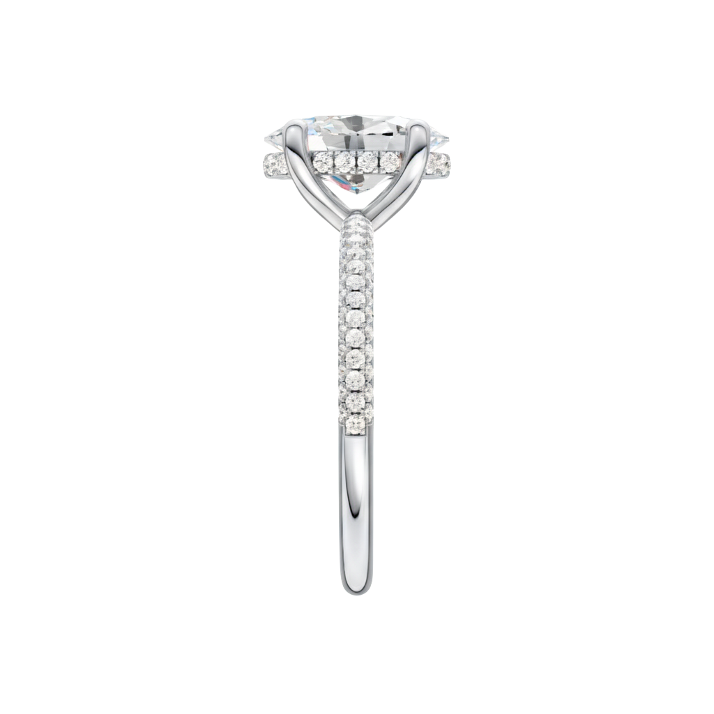 A side view of the Oval cut diamond engagement ring in 14k white gold with a pavé diamond band and cathedral setting