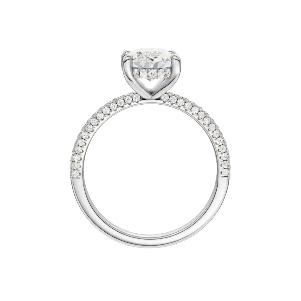 A profile view of the Oval cut diamond engagement ring in 14k white gold with a pavé diamond band and cathedral setting