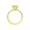 A profile view of the Oval cut diamond engagement ring in 14k yellow gold with a pavé diamond band and cathedral setting