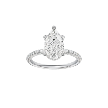 A front view of the Pear cut diamond engagement ring in 14k white gold with a pavé diamond band and cathedral setting
