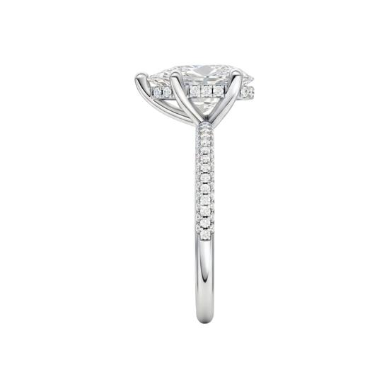A side view of the Pear cut diamond engagement ring in 14k white gold with a pavé diamond band and cathedral setting