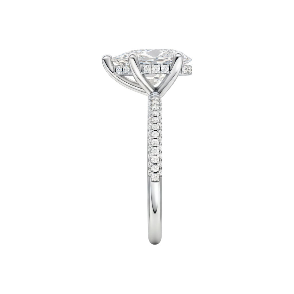 A side view of the Pear cut diamond engagement ring in 14k white gold with a pavé diamond band and cathedral setting