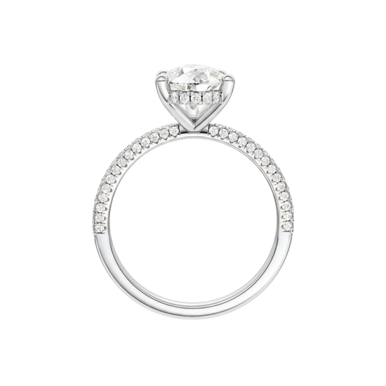 A profile view of the Pear cut diamond engagement ring in 14k white gold with a pavé diamond band and cathedral setting