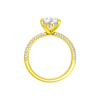 A profile view of the Pear cut diamond engagement ring in 14k yellow gold with a pavé diamond band and cathedral setting