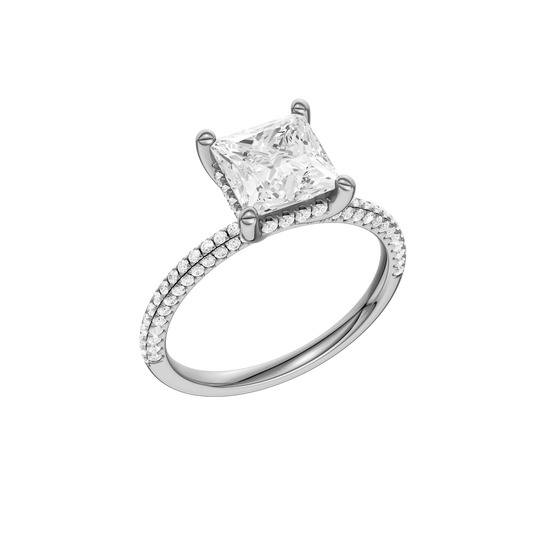 A three-quarter view of the Princess cut diamond engagement ring in 14k white gold with a pavé diamond band and cathedral setting