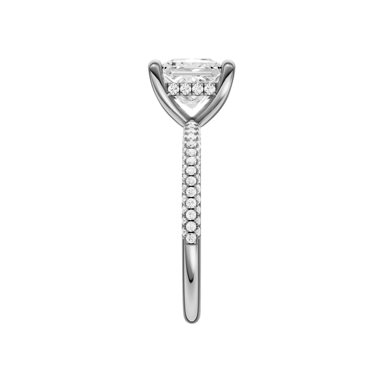 A side view of the Princess cut diamond engagement ring in platinum with a pavé diamond band and cathedral setting