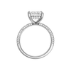 A profile view of the Princess cut diamond engagement ring in platinum with a pavé diamond band and cathedral setting