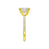 A side view of the Princess cut diamond engagement ring in 14k yellow gold with a pavé diamond band and cathedral setting
