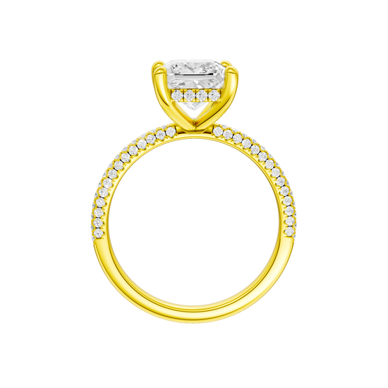 A profile view of the Princess cut diamond engagement ring in 14k yellow gold with a pavé diamond band and cathedral setting