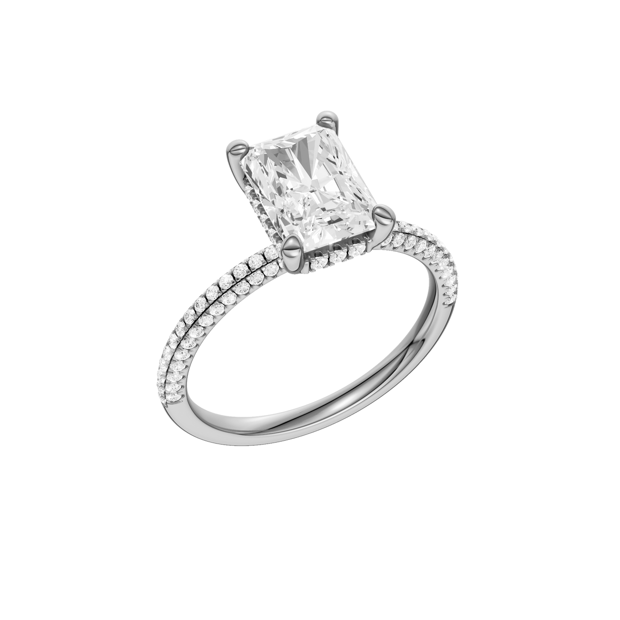 A three-quarter view of the Radiant cut diamond engagement ring in platinum with a pavé diamond band and cathedral setting