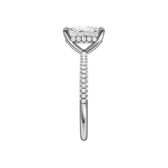 A side view of the Radiant cut diamond engagement ring in 14k white gold with a pavé diamond band and cathedral setting