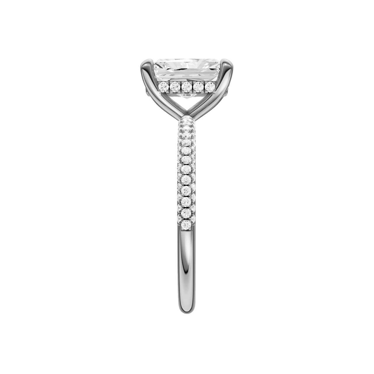 A side view of the Radiant cut diamond engagement ring in platinum with a pavé diamond band and cathedral setting