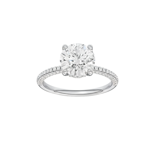 A front view of the Round cut diamond engagement ring in 14k white gold with a pavé diamond band and cathedral setting