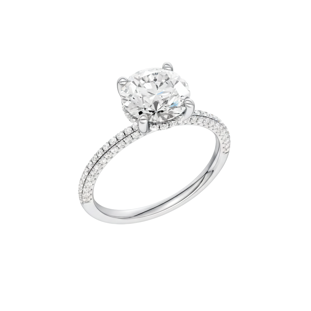 A three-quarter view of the Round cut diamond engagement ring in platinum with a pavé diamond band and cathedral setting