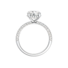 A profile view of the Round cut diamond engagement ring in platinum with a pavé diamond band and cathedral setting
