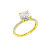 A three-quarter view of the Round cut diamond engagement ring in 14k yellow gold with a pavé diamond band and cathedral setting