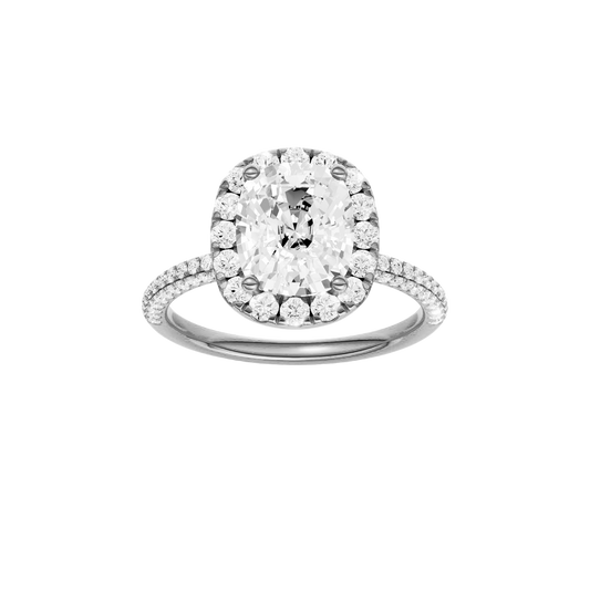A front view of the Elongated cushion cut diamond engagement ring in 14k white gold with a pavé diamond band and solitaire setting