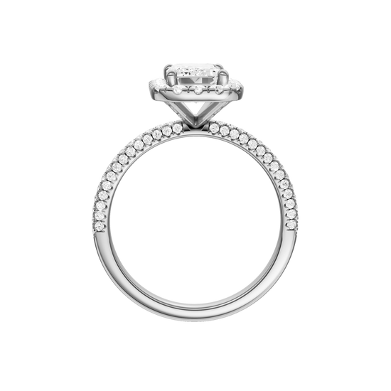 A profile view of the Emerald cut diamond engagement ring in 14k white gold with a pavé diamond band and solitaire setting