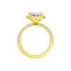 A profile view of the Emerald cut diamond engagement ring in 14k yellow gold with a pavé diamond band and solitaire setting