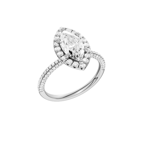 A three-quarter view of the Marquise cut diamond engagement ring in 14k white gold with a pavé diamond band and solitaire setting
