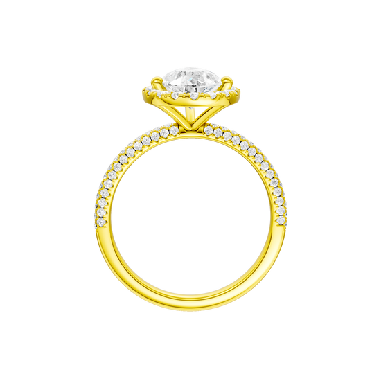 A profile view of the Pear cut diamond engagement ring in 14k yellow gold with a pavé diamond band and solitaire setting