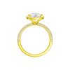 A profile view of the Pear cut diamond engagement ring in 14k yellow gold with a pavé diamond band and solitaire setting