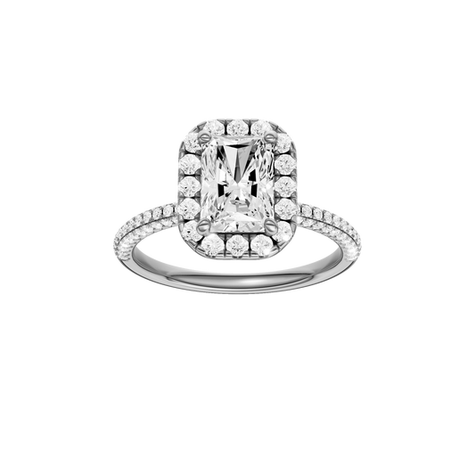 A front view of the Radiant cut diamond engagement ring in 14k white gold with a pavé diamond band and solitaire setting