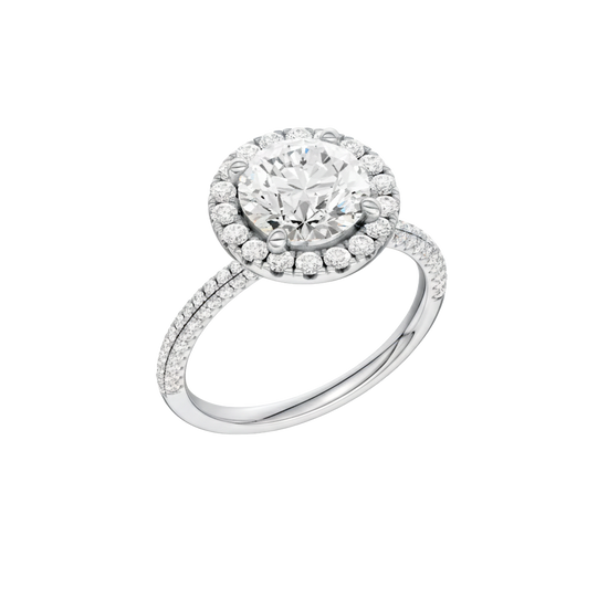A three-quarter view of the Round cut diamond engagement ring in platinum with a pavé diamond band and solitaire setting