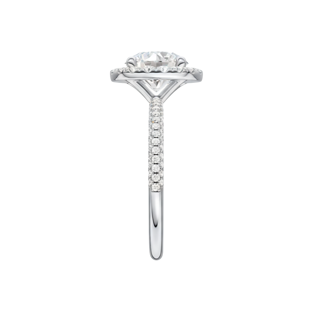 A side view of the Round cut diamond engagement ring in platinum with a pavé diamond band and solitaire setting