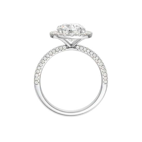 A profile view of the Round cut diamond engagement ring in 14k white gold with a pavé diamond band and solitaire setting