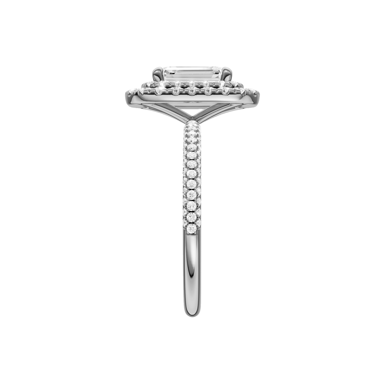 A side view of the Emerald cut diamond engagement ring in 14k white gold with a pavé diamond band and solitaire setting