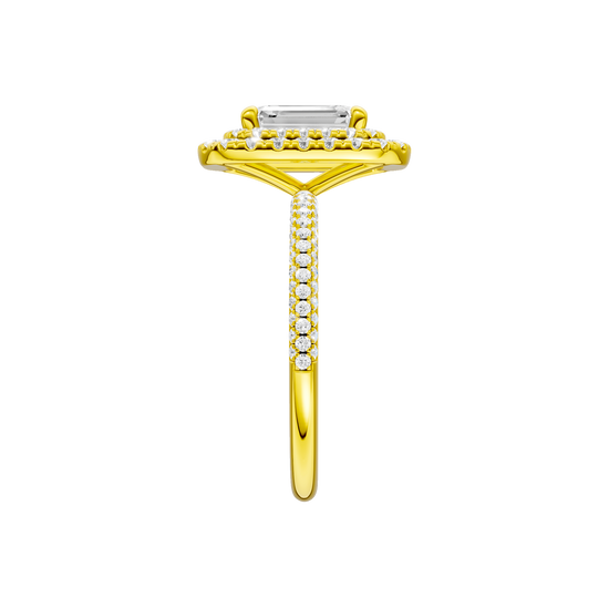 A side view of the Emerald cut diamond engagement ring in 14k yellow gold with a pavé diamond band and solitaire setting