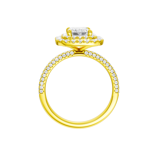 A profile view of the Emerald cut diamond engagement ring in 14k yellow gold with a pavé diamond band and solitaire setting
