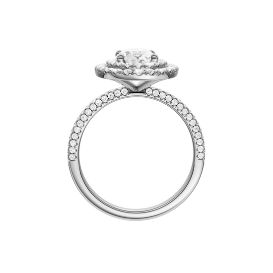 A profile view of the Oval cut diamond engagement ring in 14k white gold with a pavé diamond band and solitaire setting