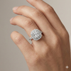 Radiant cut diamond engagement ring in 14k white gold with a pavé diamond band and solitaire setting on a hand