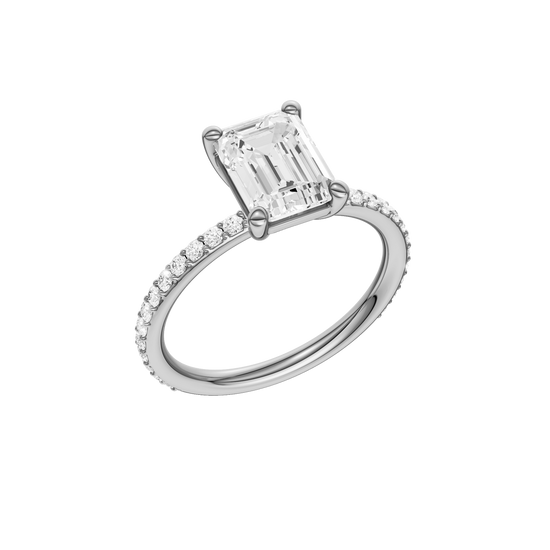 A three-quarter view of the Emerald cut diamond engagement ring in platinum with a prong diamond band and cathedral setting