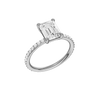 A three-quarter view of the Emerald cut diamond engagement ring in platinum with a prong diamond band and cathedral setting
