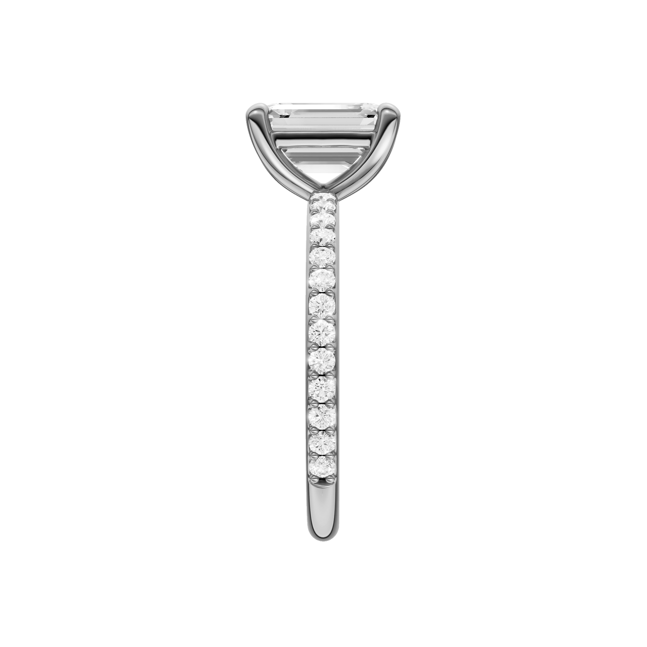 A side view of the Emerald cut diamond engagement ring in platinum with a prong diamond band and cathedral setting