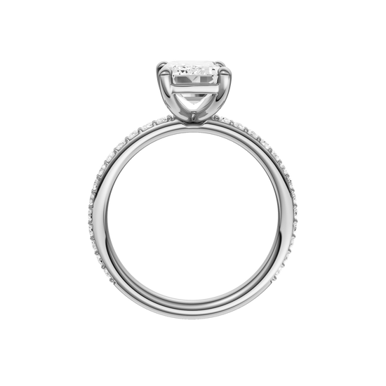 A profile view of the Emerald cut diamond engagement ring in 14k white gold with a prong diamond band and cathedral setting