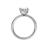 A profile view of the Emerald cut diamond engagement ring in 14k white gold with a prong diamond band and cathedral setting