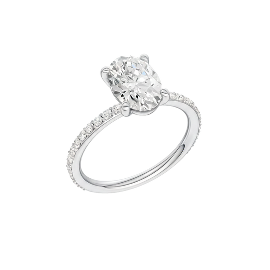A three-quarter view of the Oval cut diamond engagement ring in platinum with a prong diamond band and cathedral setting