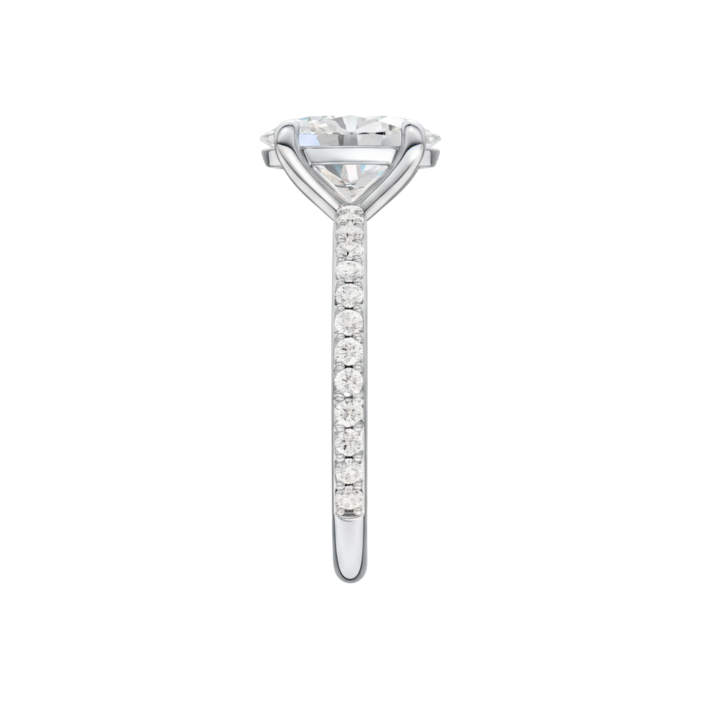 A side view of the Oval cut diamond engagement ring in platinum with a prong diamond band and cathedral setting